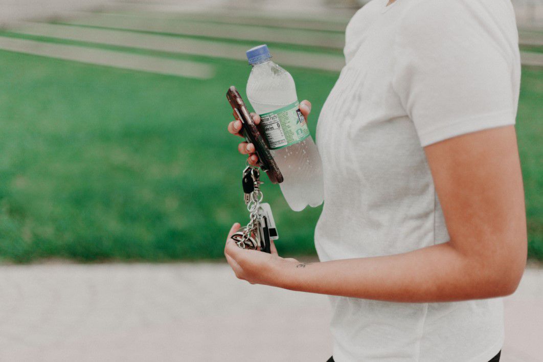 Woman Holding Bottle