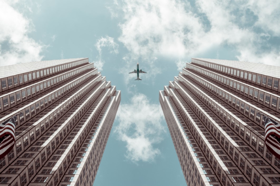 Airplane Between Buildings